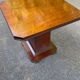Art Deco dining table in rosewood from the 1950s with a central leg.