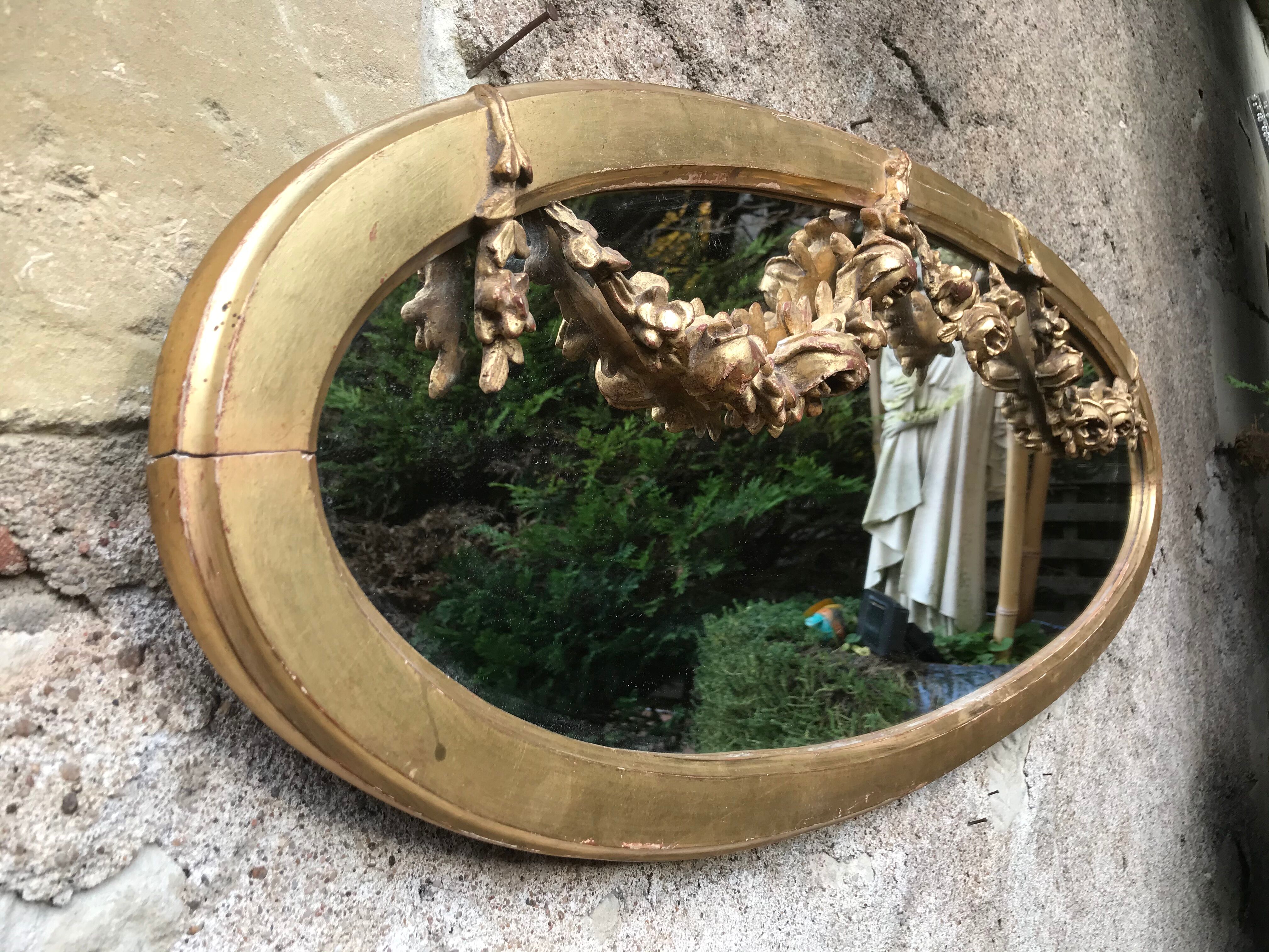 Golden oval mirror with gold leaf 106 x 38 cm