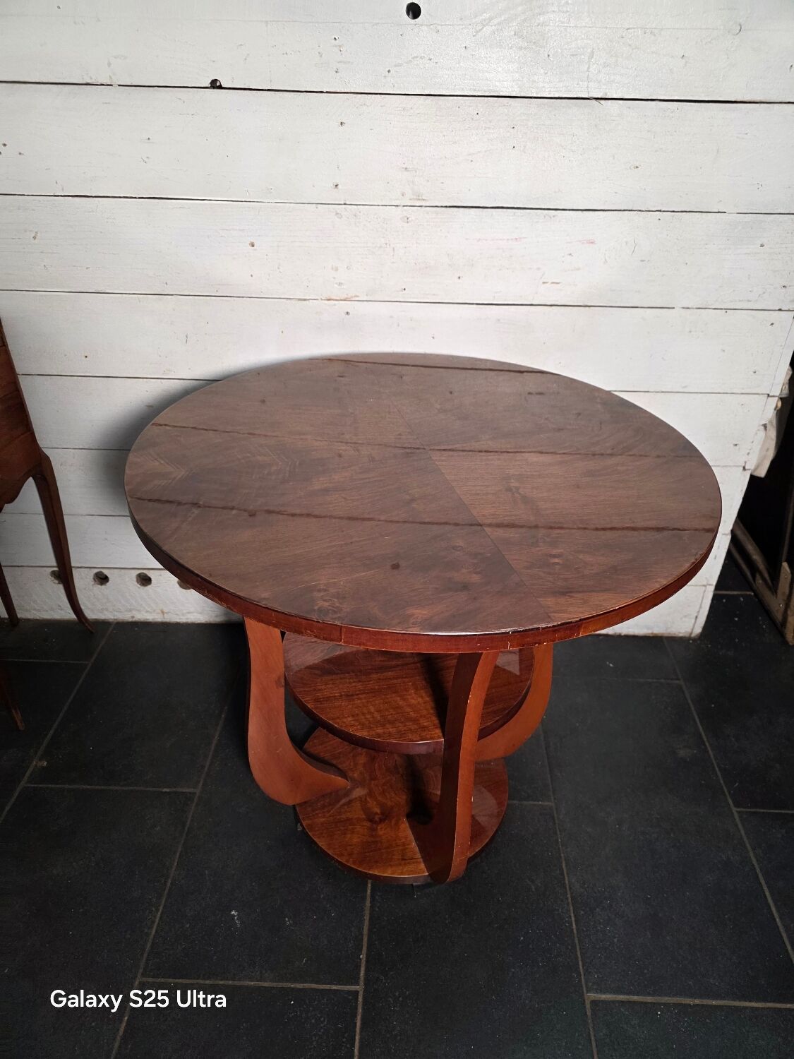 Art Deco walnut gueridon with double top from the 1930s.