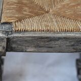 Patinated wooden stool with straw seat