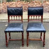 Two 19th-century Henri II chairs in solid wood and black leather upholstery