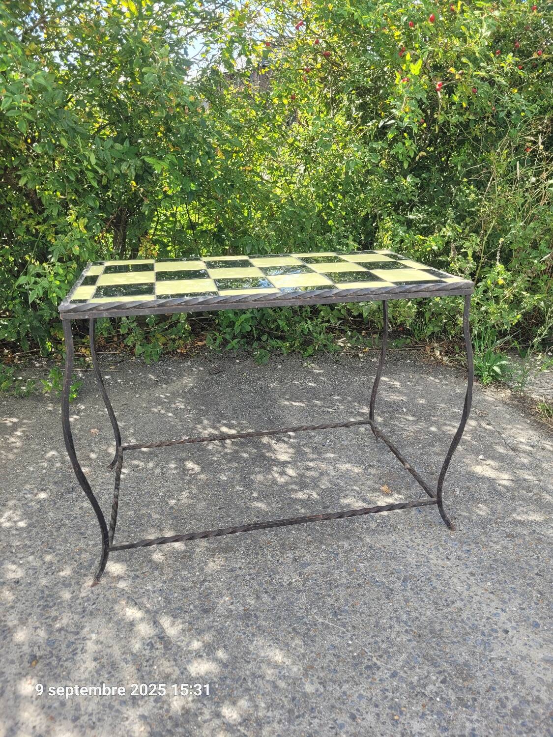 Coffee table with tiled and wrought iron finish