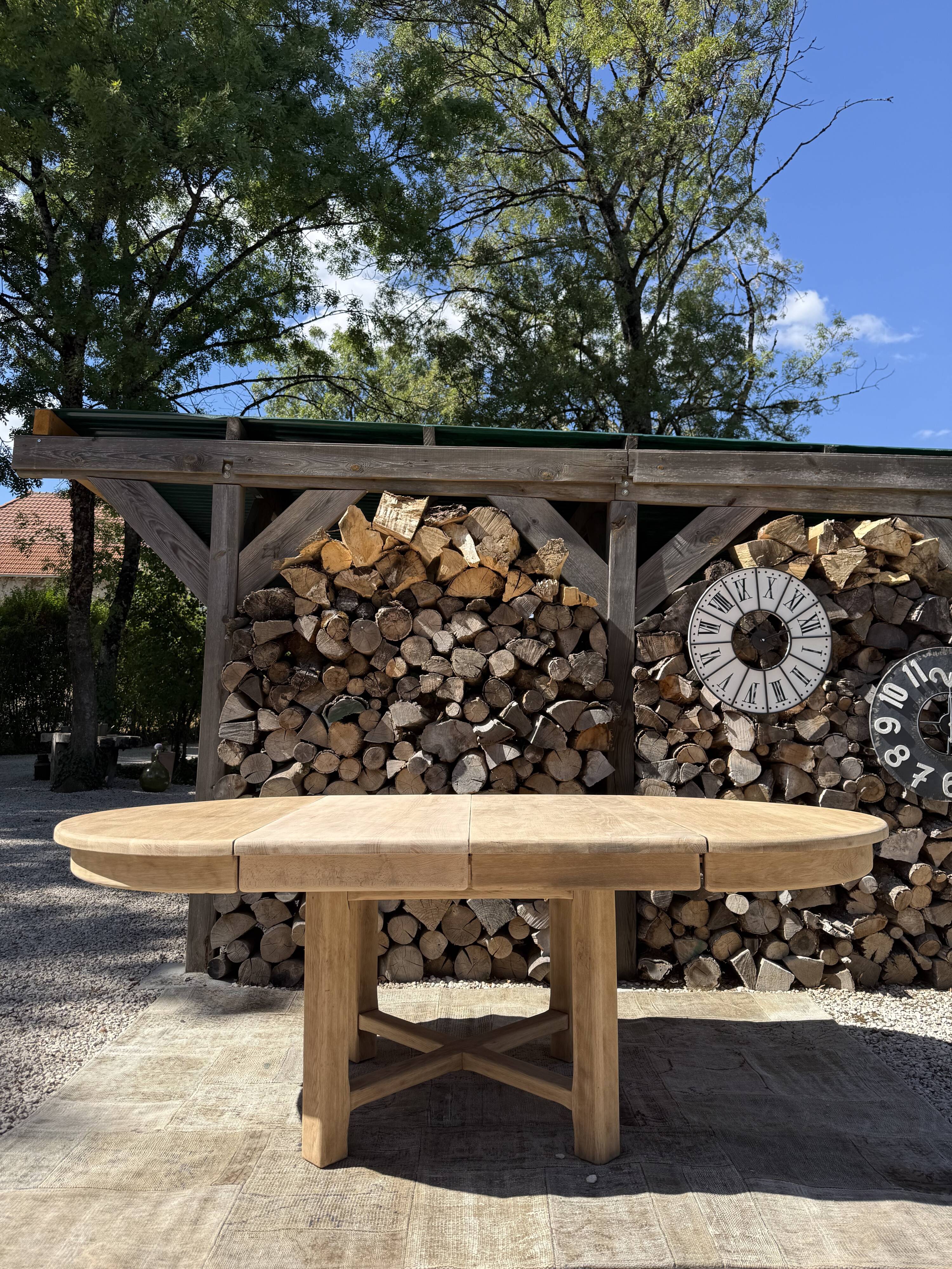 Round solid oak table with extensions, maximum 220cm.