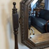 Antique beveled octagonal vanity mirror in carved wood