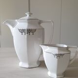 Old coffee maker and its milk pot