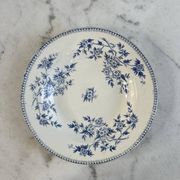 Hollow plate in ironstone from Terre de Feu of Grigny with floral decoration bl