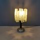 Table lamp with a teak ‘trunk’, silver-coloured metal base, acrylic shade