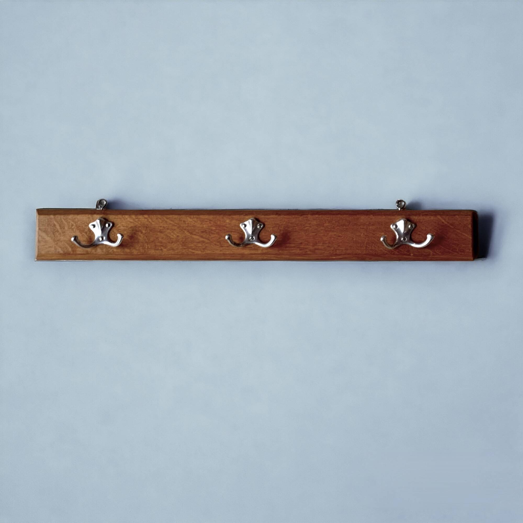 Vintage wooden wall-mounted coat rack with three double hooks