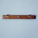 Vintage wooden wall-mounted coat rack with three double hooks
