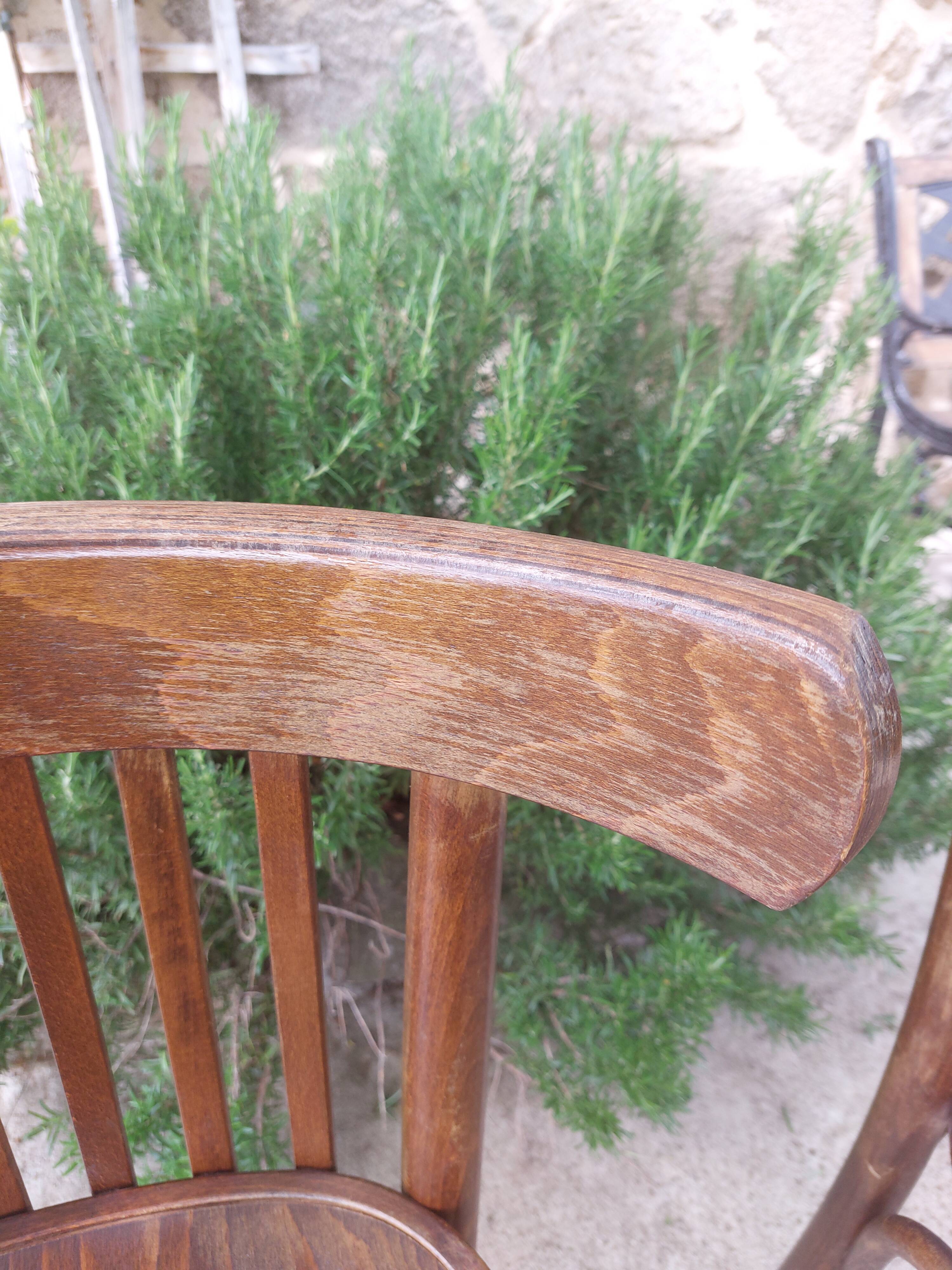 pair of dark bistro chairs, rounded backs, Baumann style