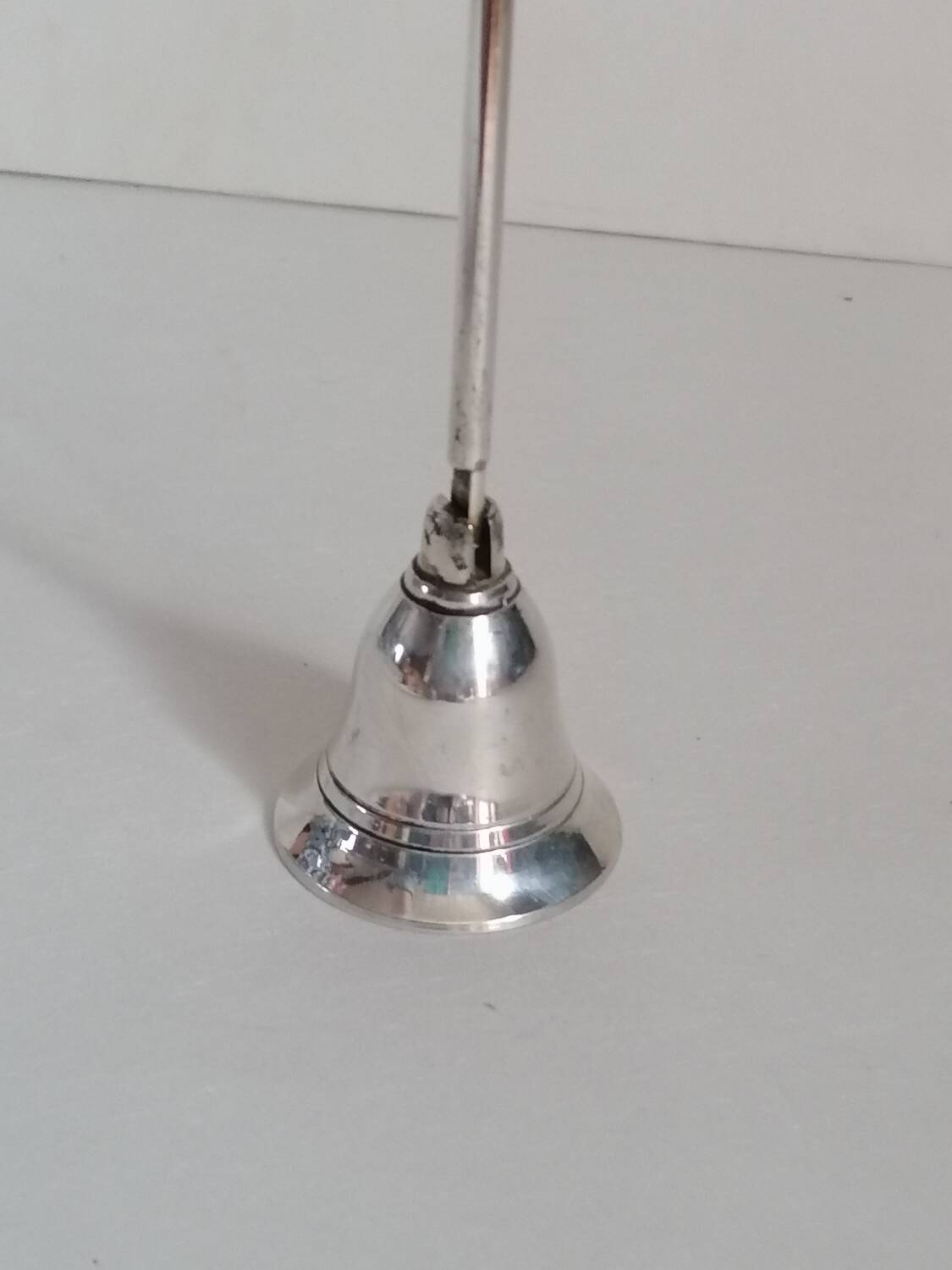 Silver metal candle snuffer