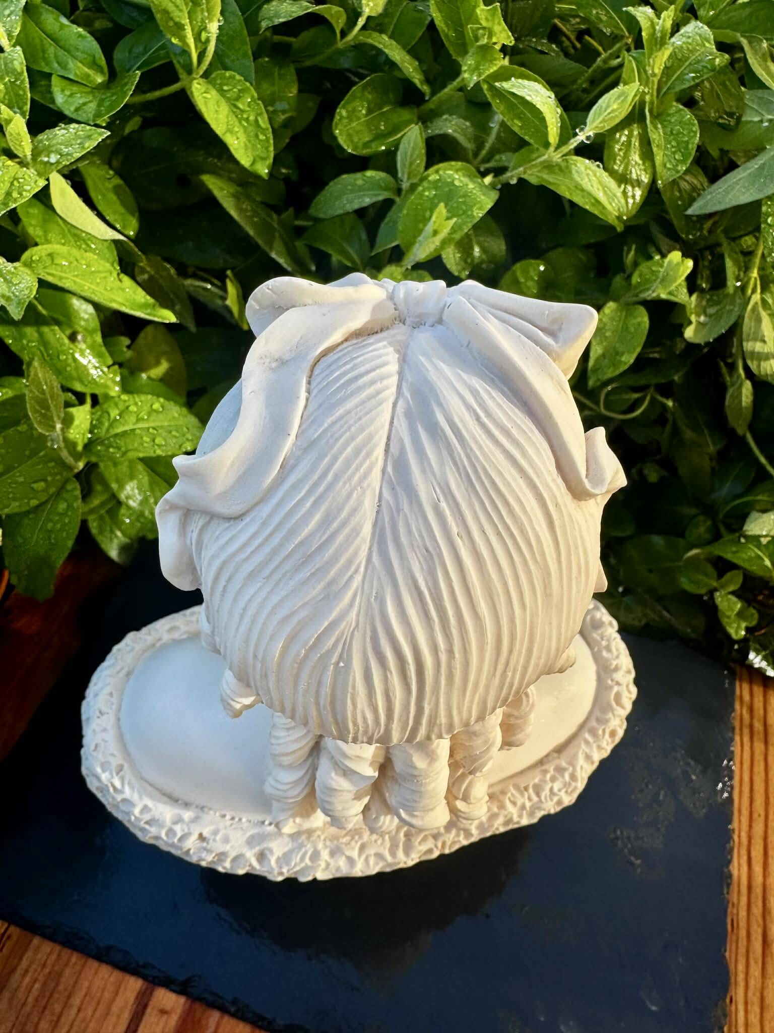 Bust of a woman signed Arnaldo Giannelli dated 1972.