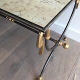 Coffee table in brushed steel and brass