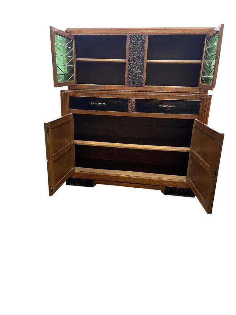 Vintage Art Deco display cabinet in wood with green stained glass.