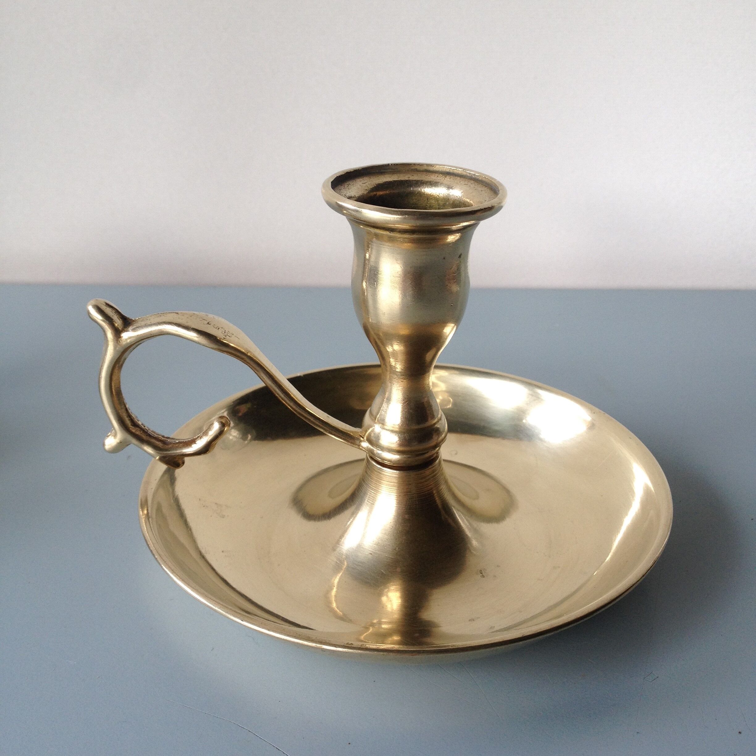 Thumb taper brass candlestick