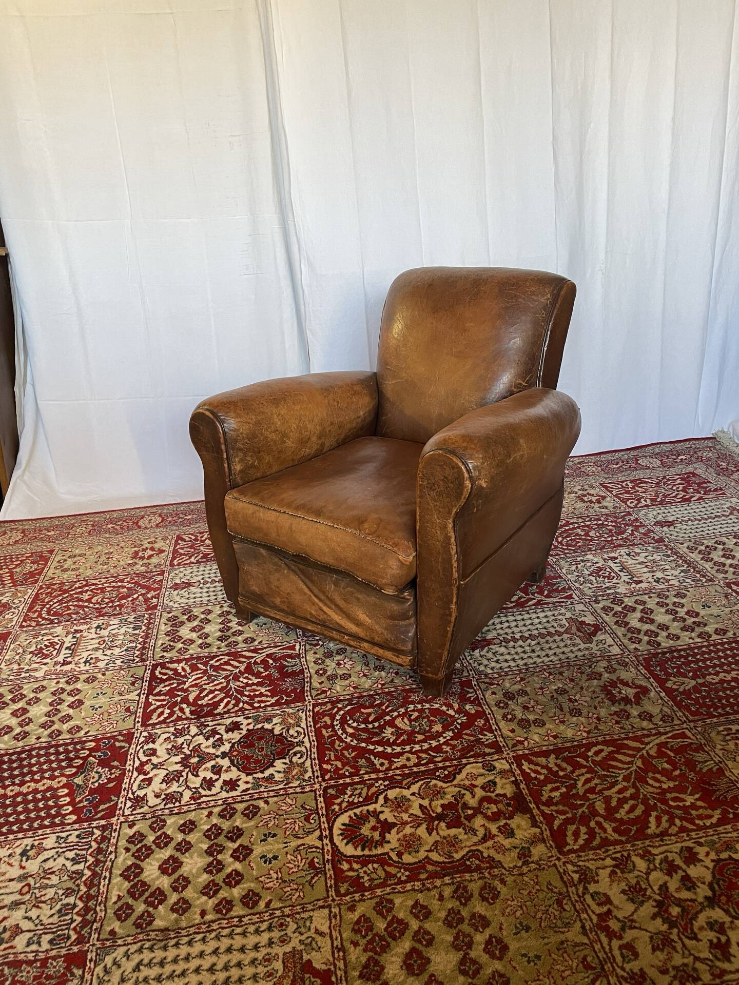 Vintage club armchair in cowhide leather