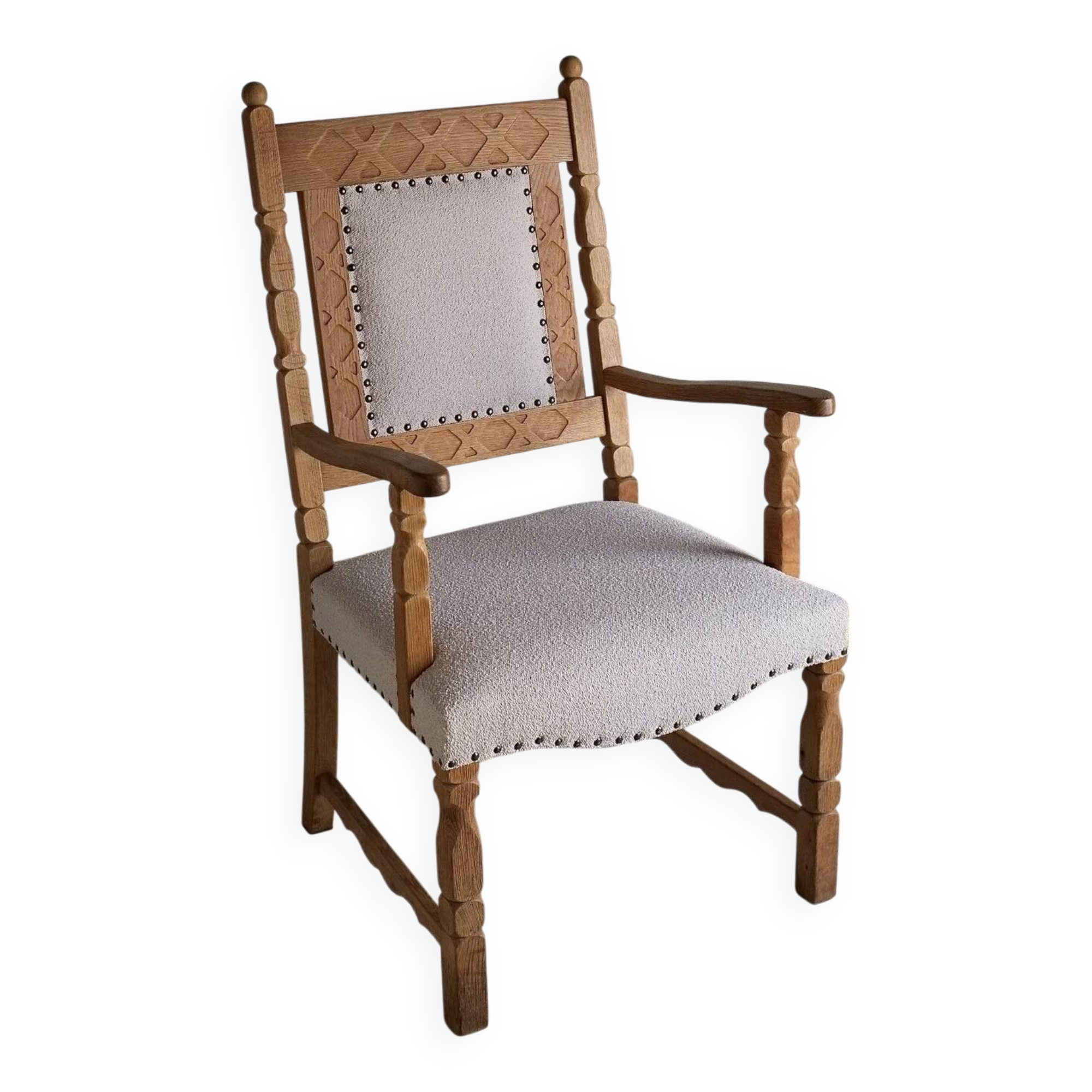 Carved oak armchair by Henning Kjaernulf | Denmark | 1960s