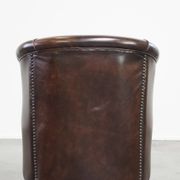 luxury dark leather club chair with English-style ball feet