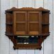 Early 20th-century English wall shelf in walnut.