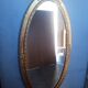 Miroir ovale 134cm bois et stuc doré debut XXem
