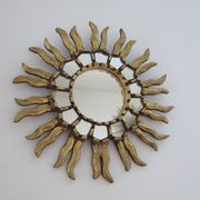 Golden wooden sun mirror with inlays from the early 20th century.