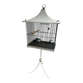Mid-century pagoda bird cage on stand — white & black metal with brass accents