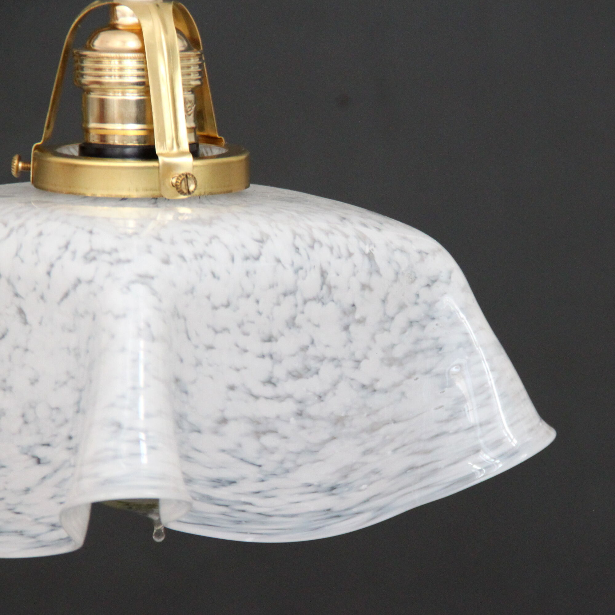Hanging lamp draped in glass