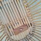Rattan cradle for doll on vintage wheels