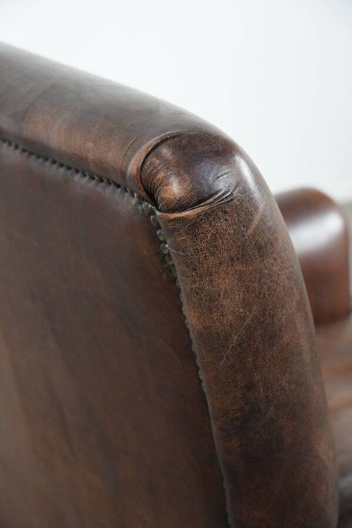Characterful sheep leather armchair with a beautiful deep colour