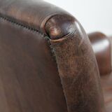 Characterful sheep leather armchair with a beautiful deep colour