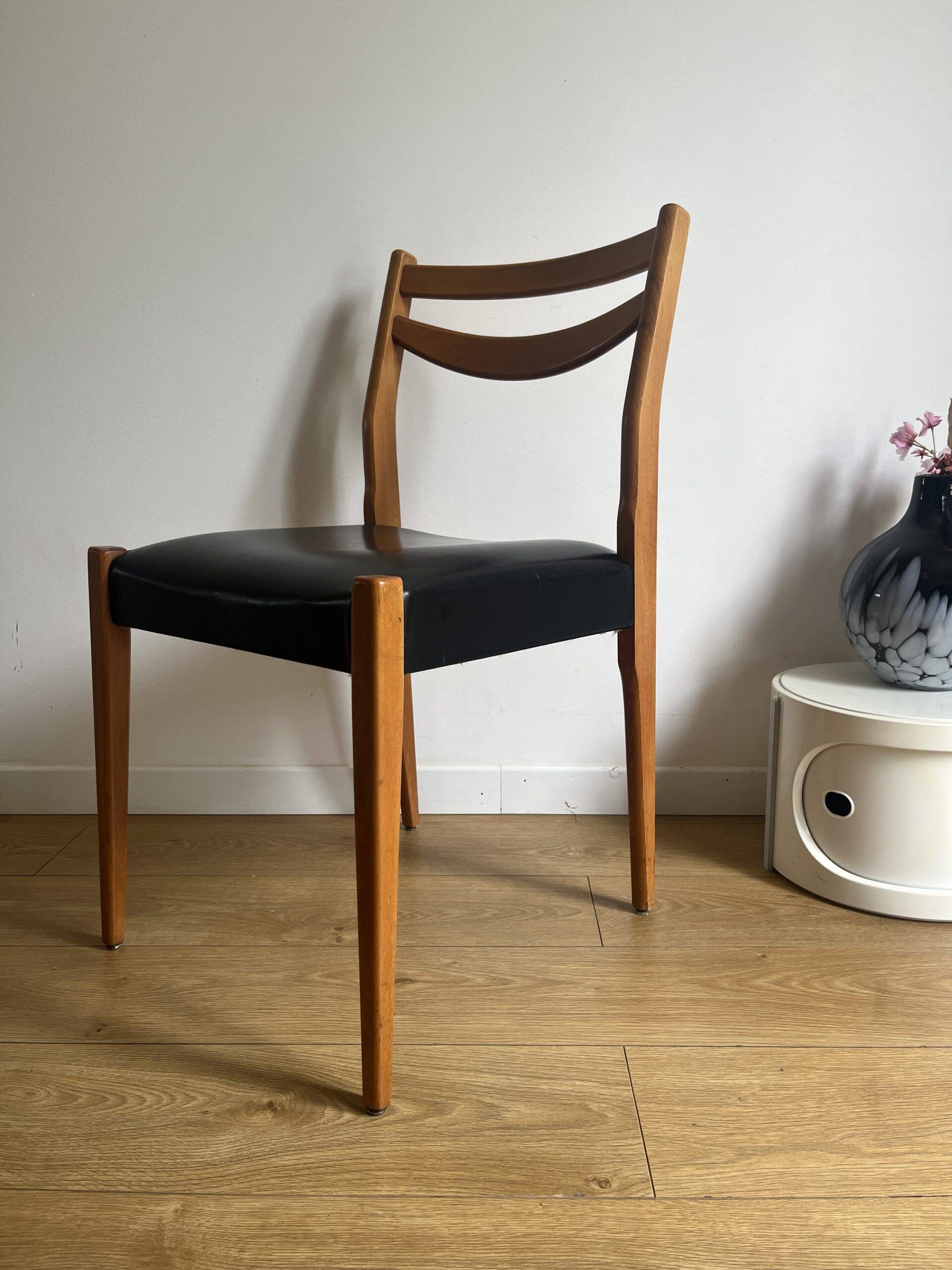 Vintage chair in wood and black leatherette