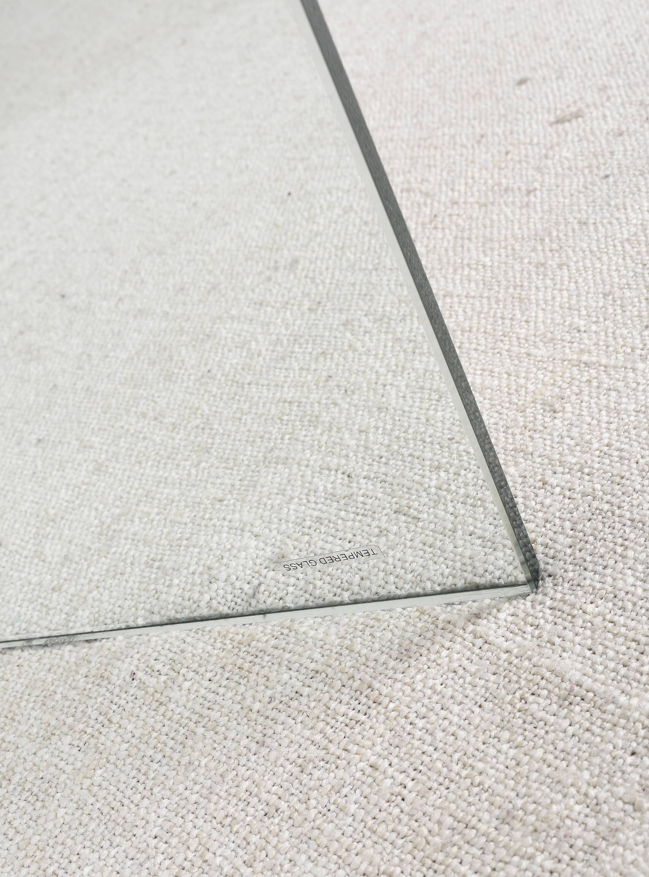 Transparent tempered glass coffee table.