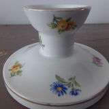 Old candle holder in flowered porcelain