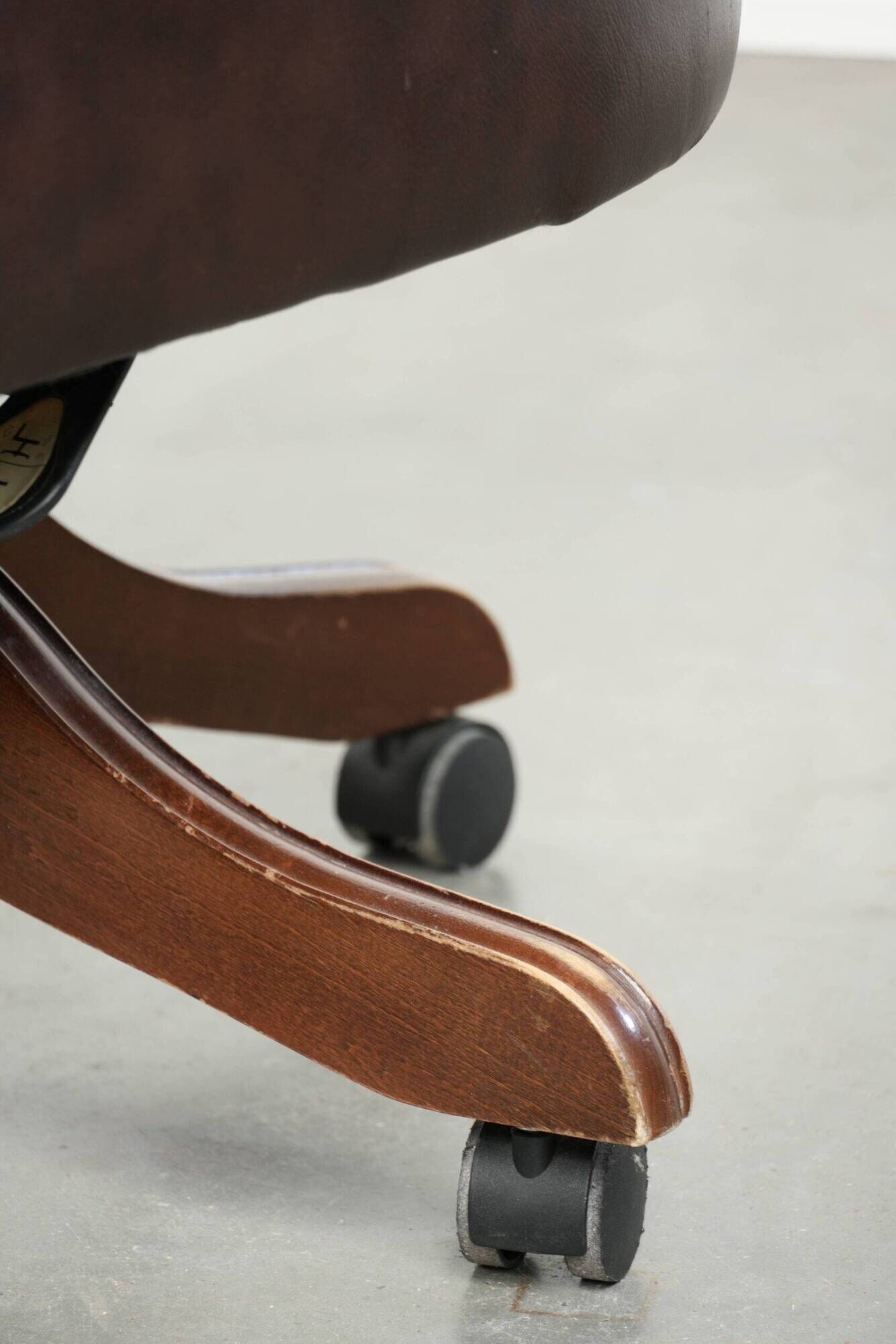 Brown cow leather Chesterfield office chair on wheels in English style