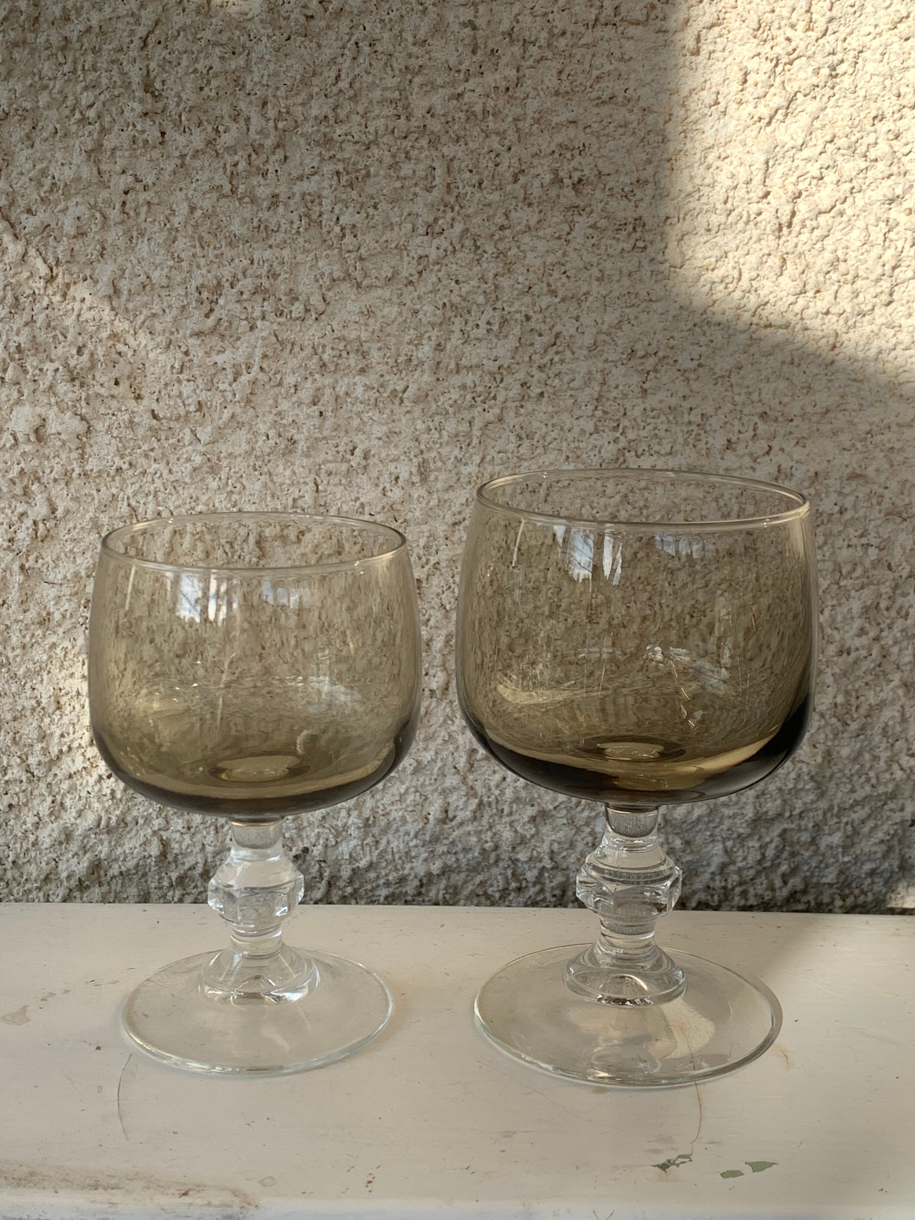 11 wine and water glasses in smoked grey glass and transparent base vintage 1970