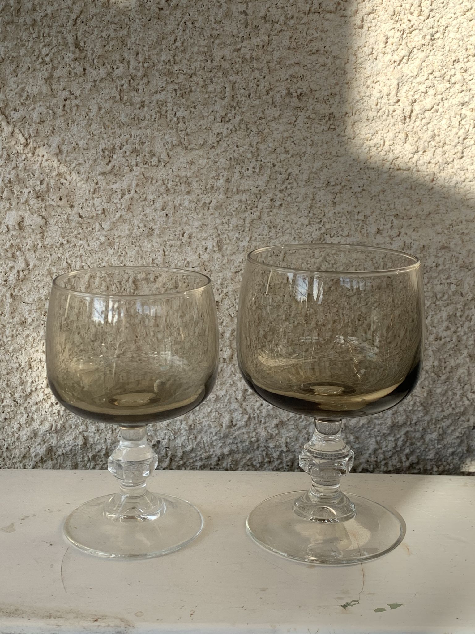11 wine and water glasses in smoked grey glass and transparent base vintage 1970