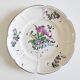 Eastern earthenware plate with flowers