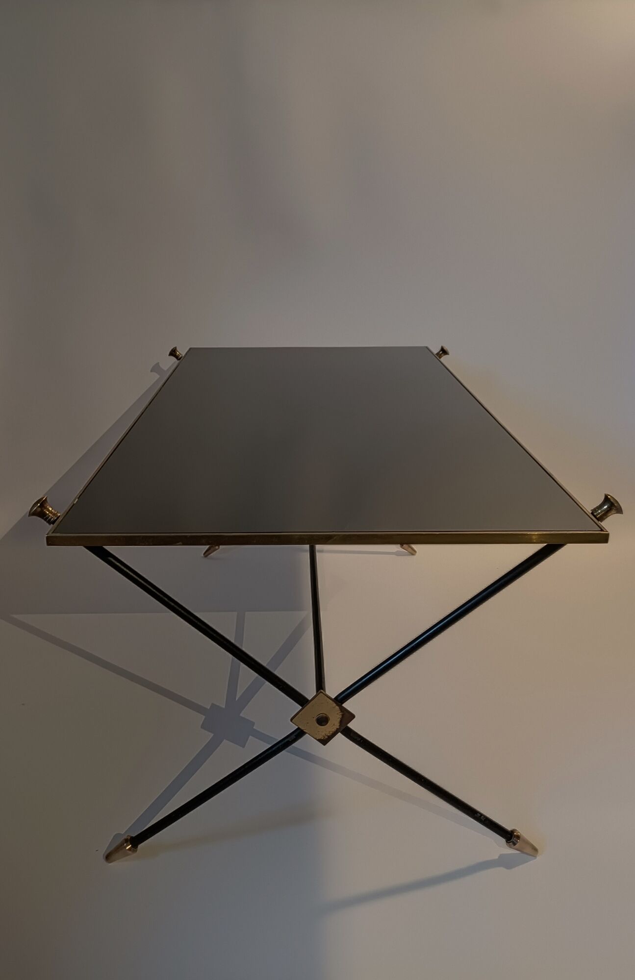 Coffee table in gilded brass, black metal and black opaline top, circa 1950