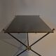 Coffee table in gilded brass, black metal and black opaline top, circa 1950