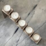 Chrome-plated metal candle holder