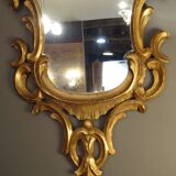 Carved and gilded wooden mirror with gold leaf 46 x 103 cm