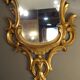 Carved and gilded wooden mirror with gold leaf 46 x 103 cm