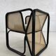 Cubic armchair in black rattan and canework