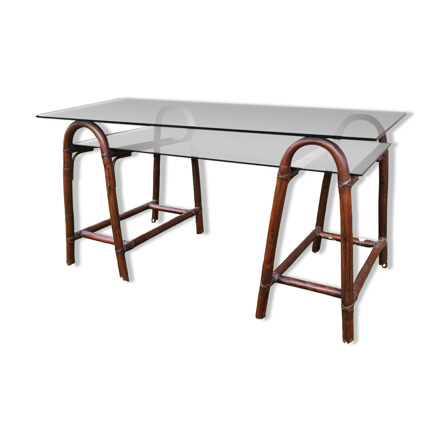 Smoked glass desk on rattan legs and leather detail