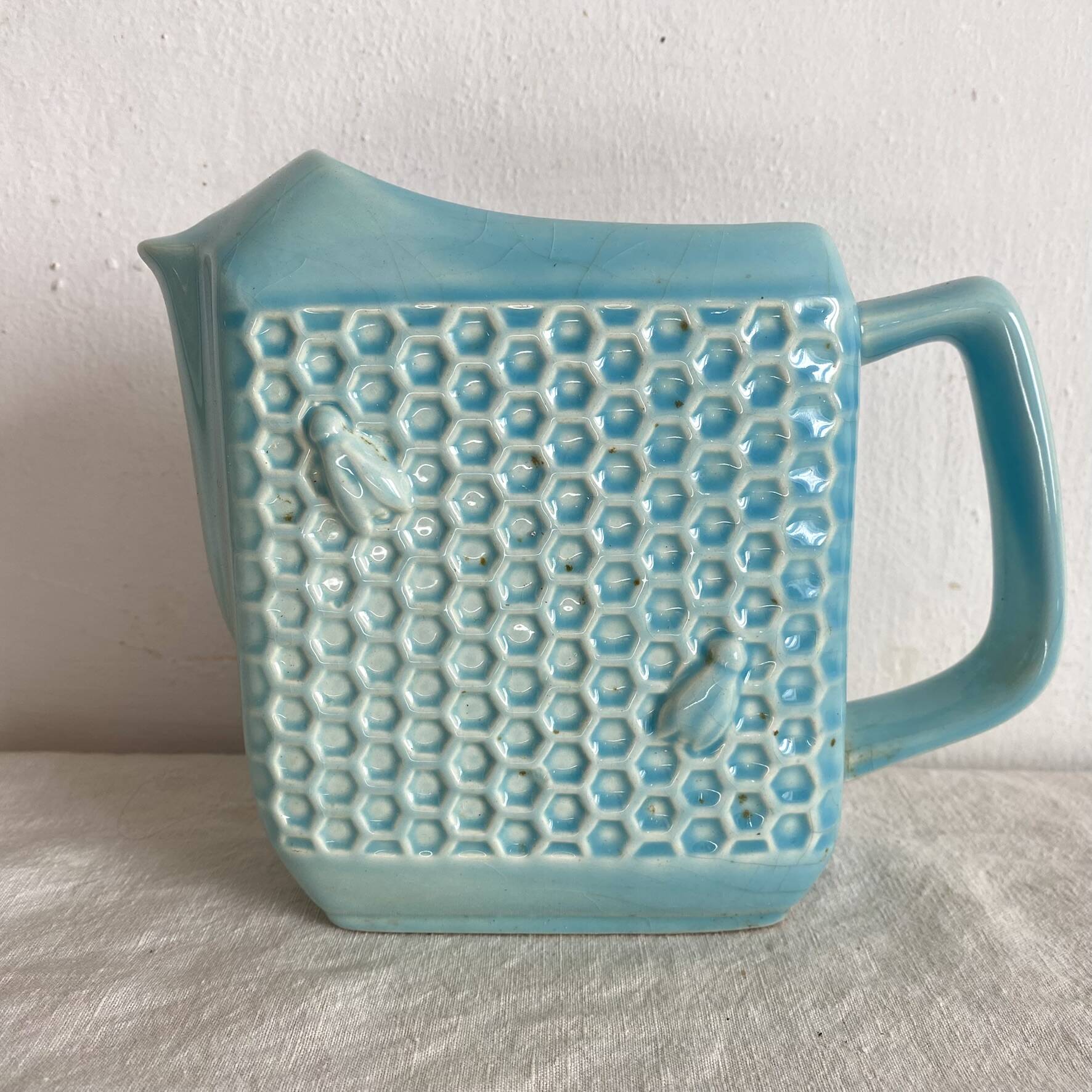 St Clément earthenware jug with bee decoration.