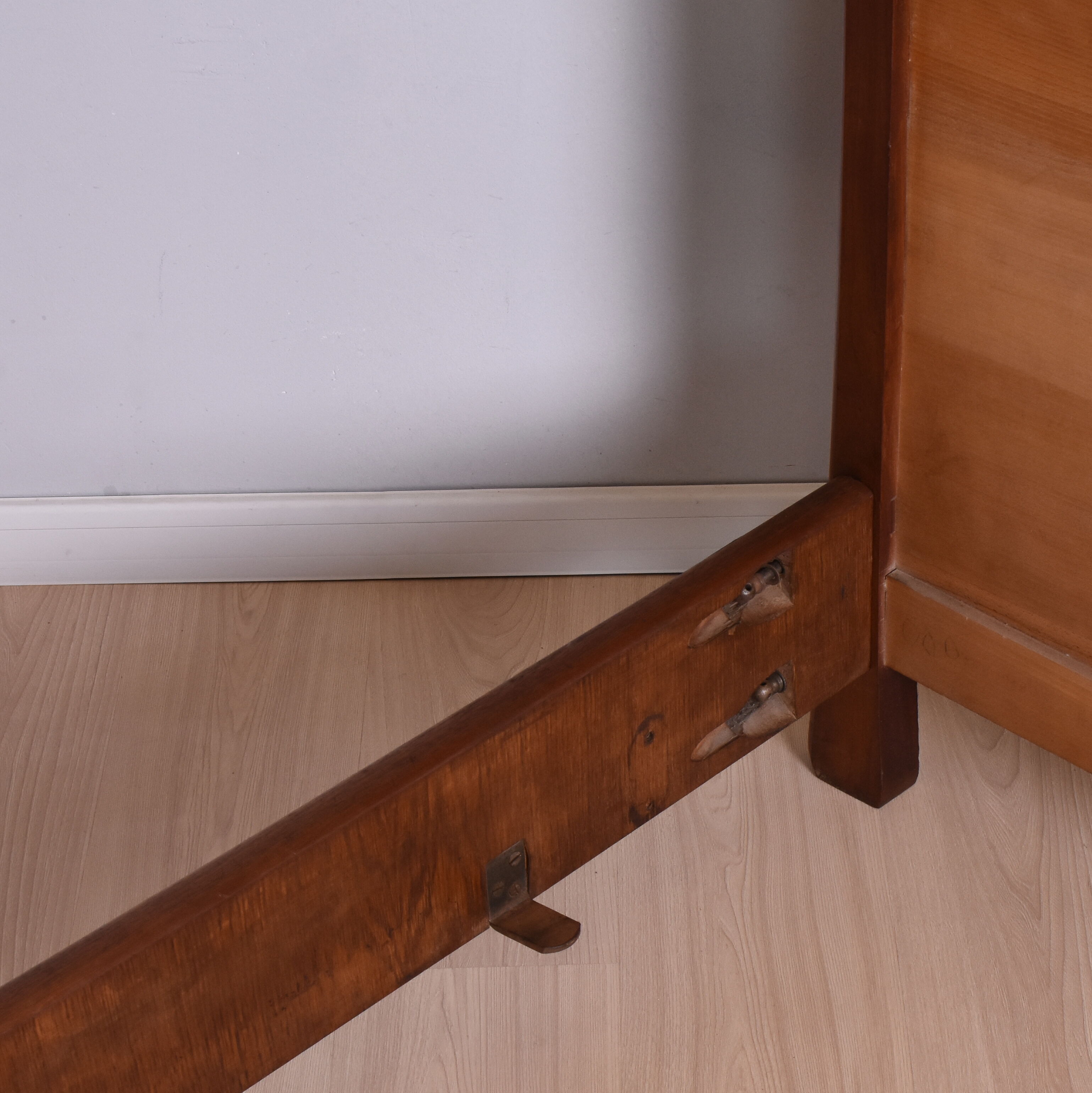 Wooden bed, early 20th century.