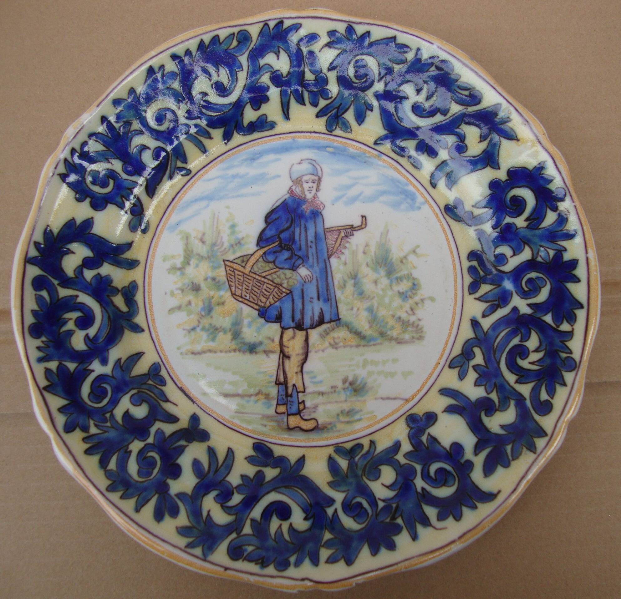 Old earthenware plate decorated with a character marked Le HAVRE