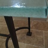 Table plateau en verre et pieds en fer forgé