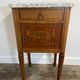 Louis XVI style bedside table, with a marble top and marquetry.