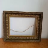 Frame with channels in wood and gilded stucco